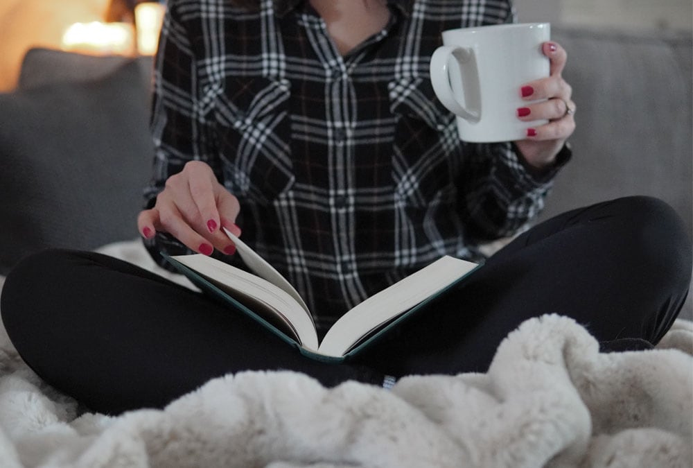 Read_Book_Holding_Coffee