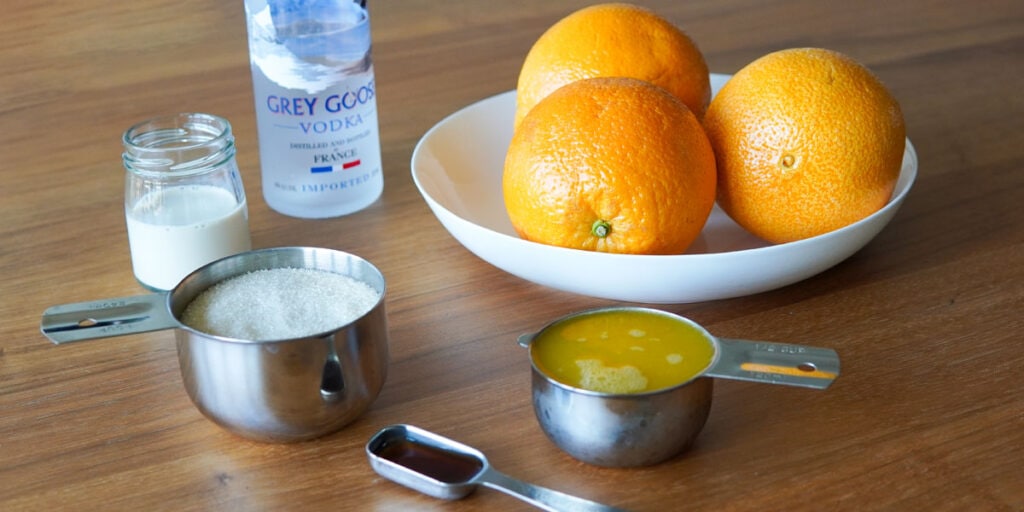 Oranges in a bowl, orange juice, vanilla, sugar, non dairy creamer, vodka