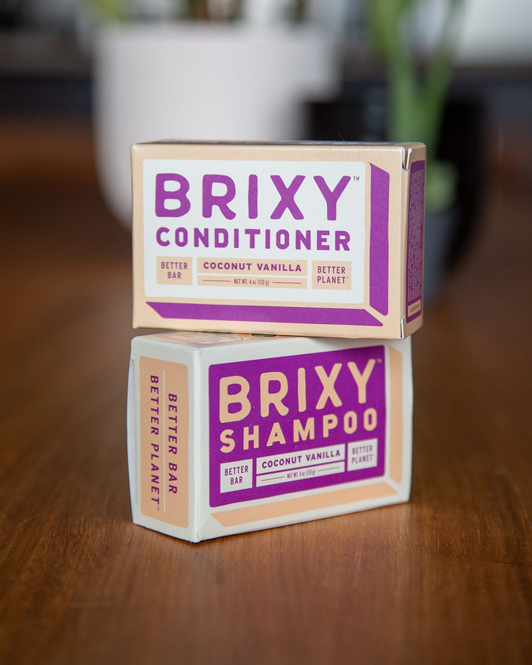 Brixy Shampoo Bar and Brixy Conditioner Bar on wood table