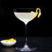 French 75 Mocktail with Lemon Twist in Coupe Glass and Black Background