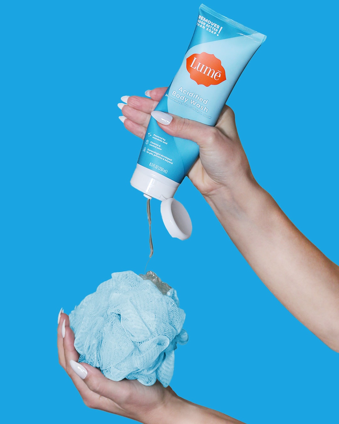 Unscented Lume Body Wash on Blue Background with Blue Pouf