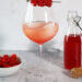 Raspberry Champagne Spritzer with Raspberry Simple Syrup and Fresh Raspberries