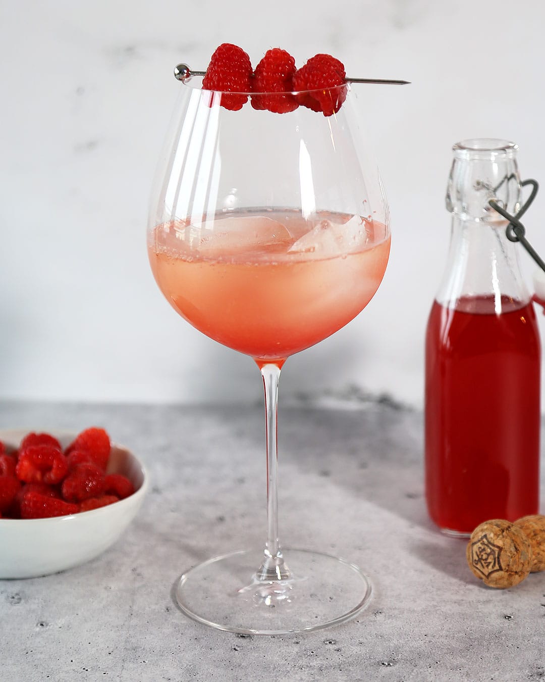 Raspberry Champagne Spritzer with Raspberry Simple Syrup and Fresh Raspberries