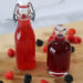 Raspberry Simple Syrup and Blackberry Simple Syrup in glass bottles